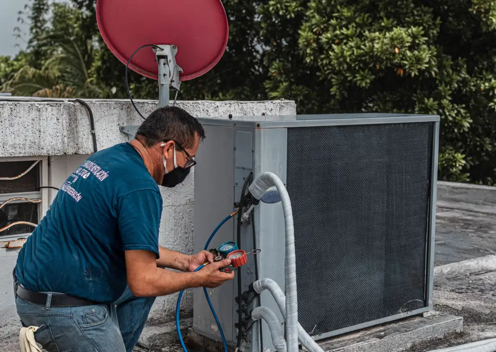 AC repair in Dubai Marina: technician checking an outdoor AC unit
